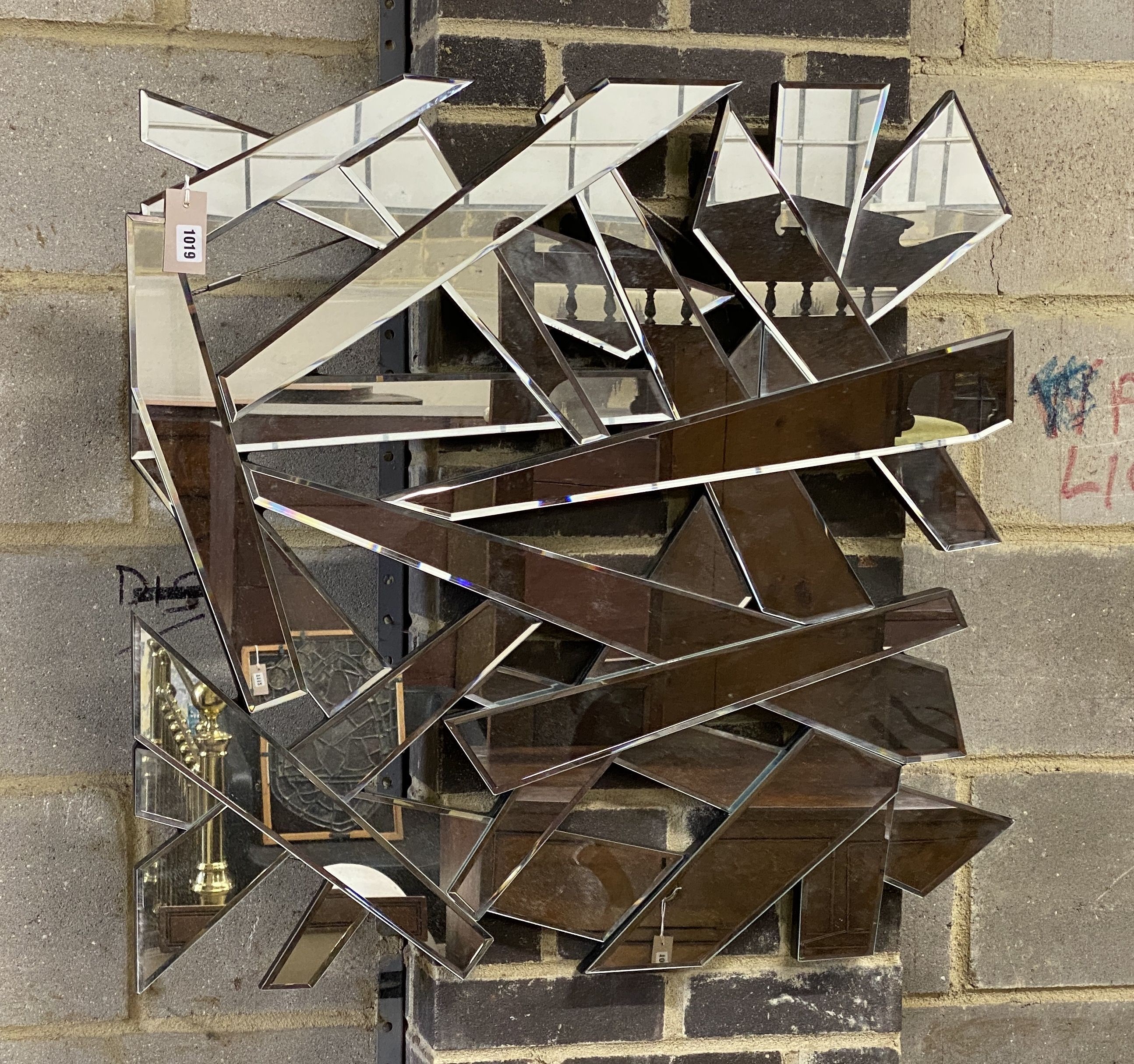 A contemporary wall mirror, width 80cm, height 80cm